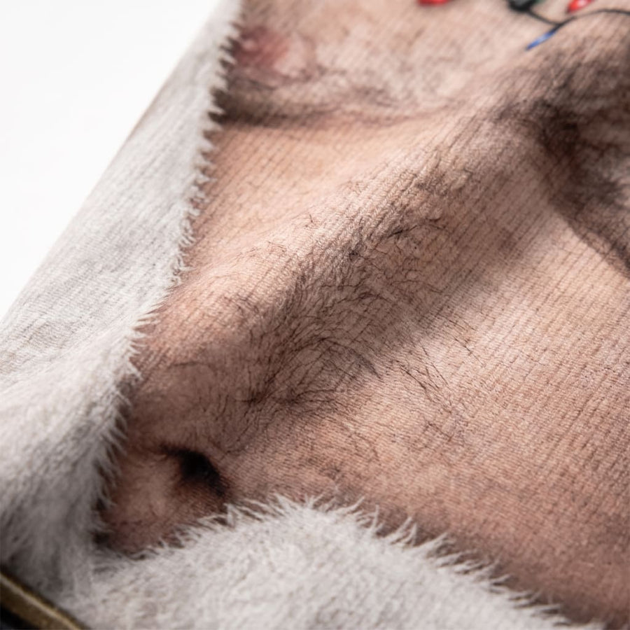 Close-up of the JingleDrip Santa Bod print showing chest hair detail